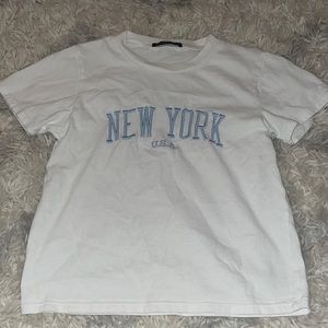 New York brandy melville tee that is sold at pacsun